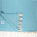 Lightweight Turkish Bath & Home criss cross bed cover throw with a stylish pattern, perfect for bedroom decor.