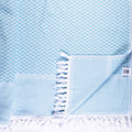 Turkish Bath & Home Wave lightweight throw with soft, woven fabric in a stylish wave pattern, perfect for cozying up.