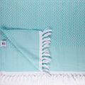 Turkish Bath & Home Crossword Flat Weave Towel featuring a woven pattern in neutral tones, displayed folded on a clean background.
