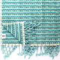 Large thick looped hand towel by Turkish Bath & Home, showing soft, plush textured loops in neutral color.