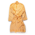 Turkish Bath & Home star flat weave robe with geometric pattern, soft fabric, and comfortable fit, displayed hanging on a wooden hook.