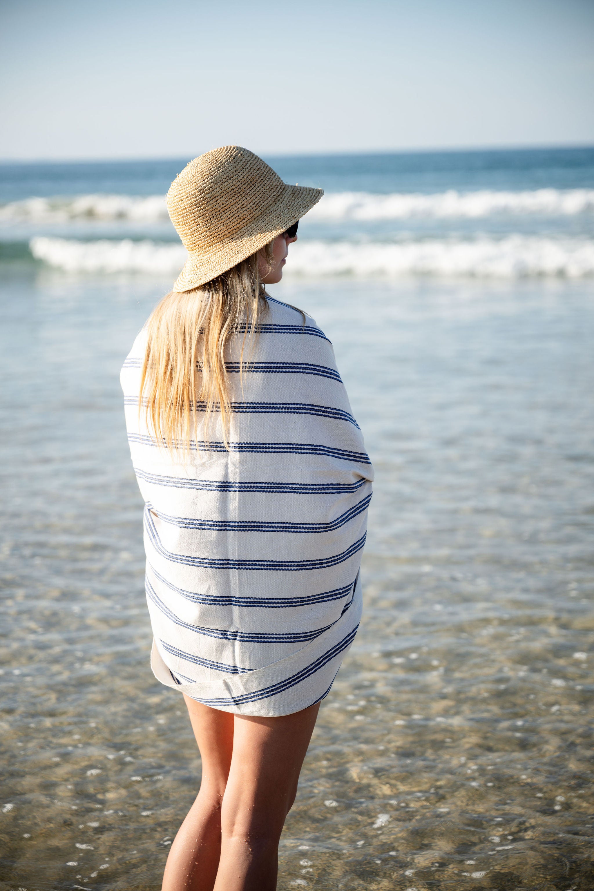 Turkish Bath & Home bold vertical stripe flat weave towel or throw with striking pattern and vibrant colors.