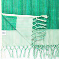 Medium seamed thick looped Turkish handwoven towel with dense looping texture and natural beige color.
