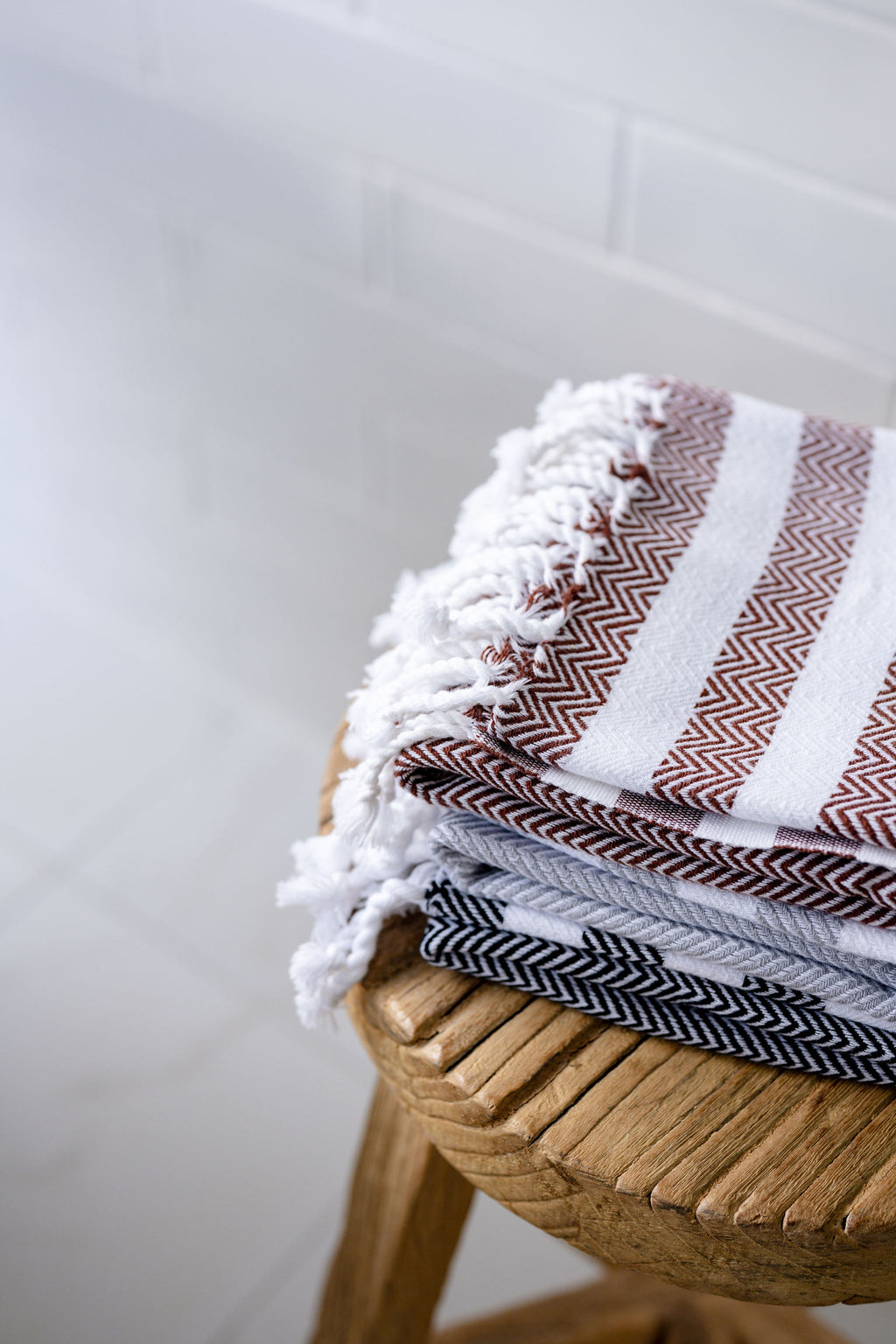 Lightweight Turkish Bath & Home hand towel with a stylish stripe cross design and flat weave texture.