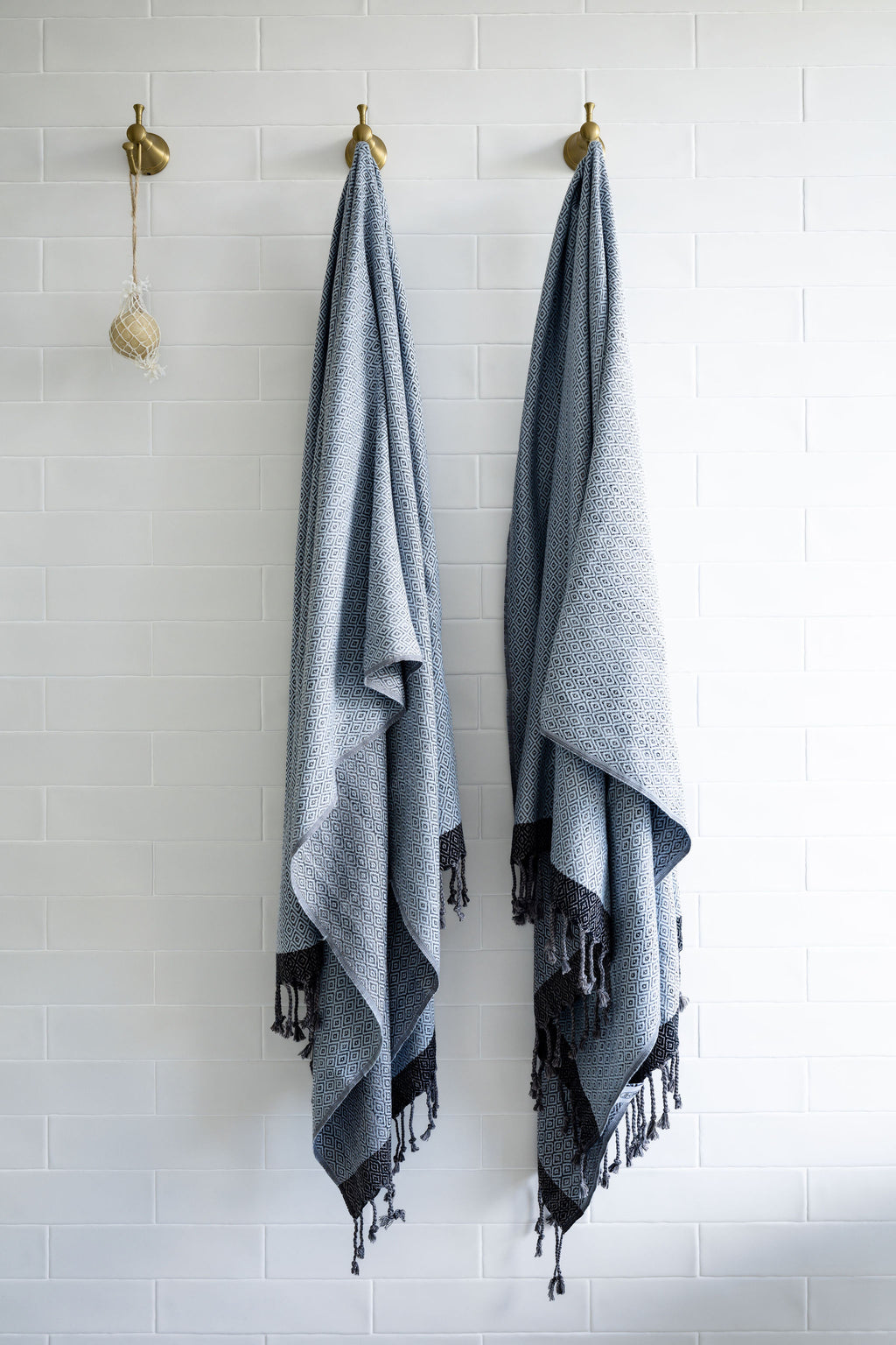 Turkish Bath & Home Diamond Collection lightweight towel or throw with a flat weave design in soft, neutral tones.