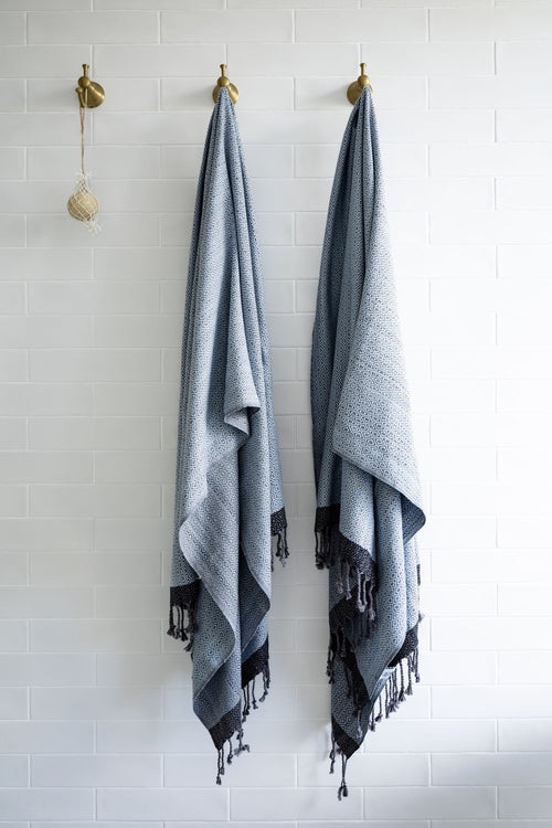 Turkish Bath & Home Diamond Collection lightweight towel or throw with a flat weave design in soft, neutral tones.