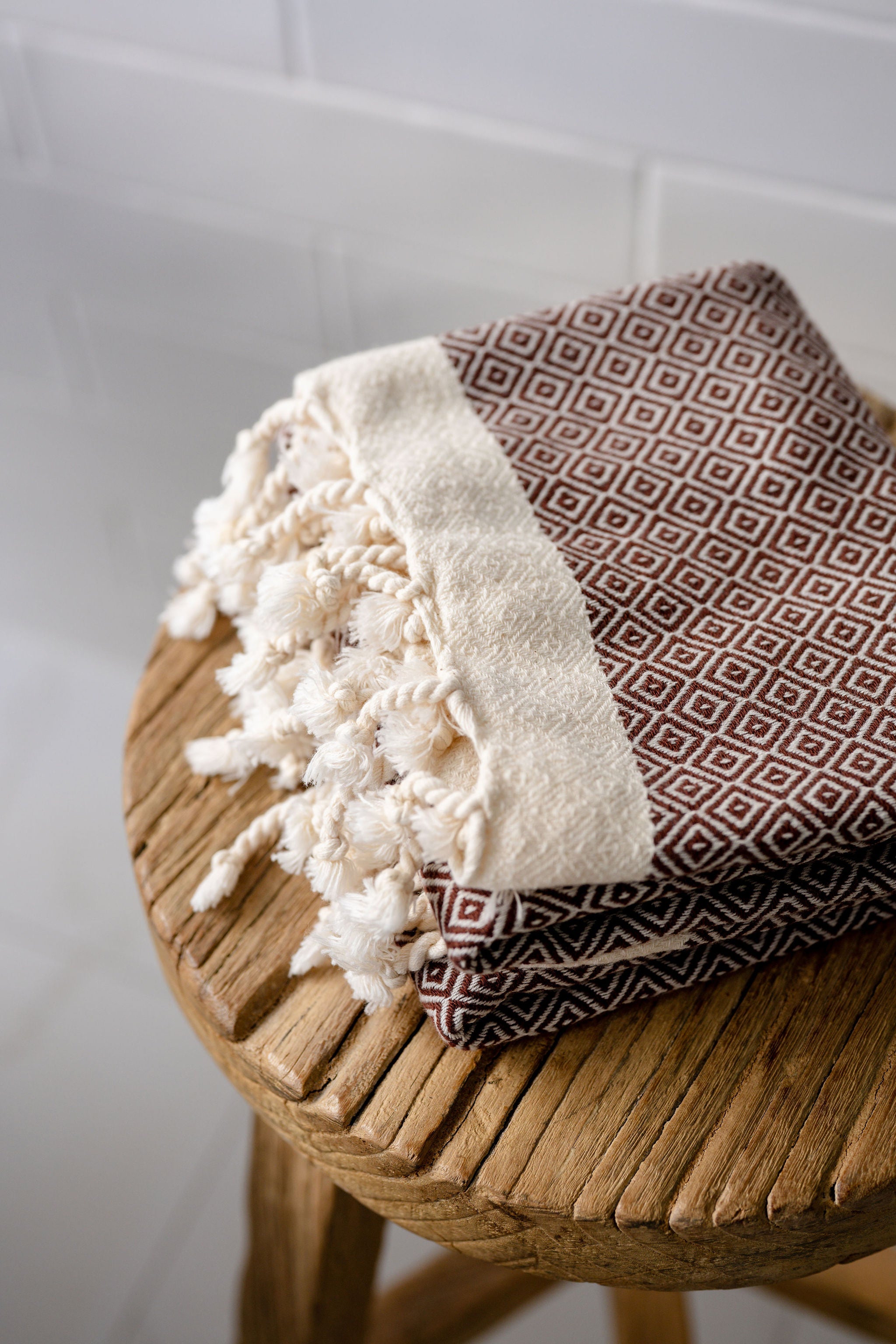 Turkish Bath & Home diamond design flat weave hand towel with intricate pattern and soft fabric, ideal for bathroom decor.