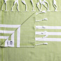 Lightweight Turkish Bath & Home striped towels with bold colors, perfect for bathroom or beach use, showcasing vibrant pattern and soft fabric.