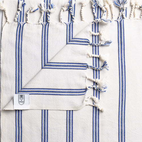 Turkish Bath & Home bold vertical stripe flat weave towel or throw with vibrant colors and textured pattern, ideal for bathroom or decor.