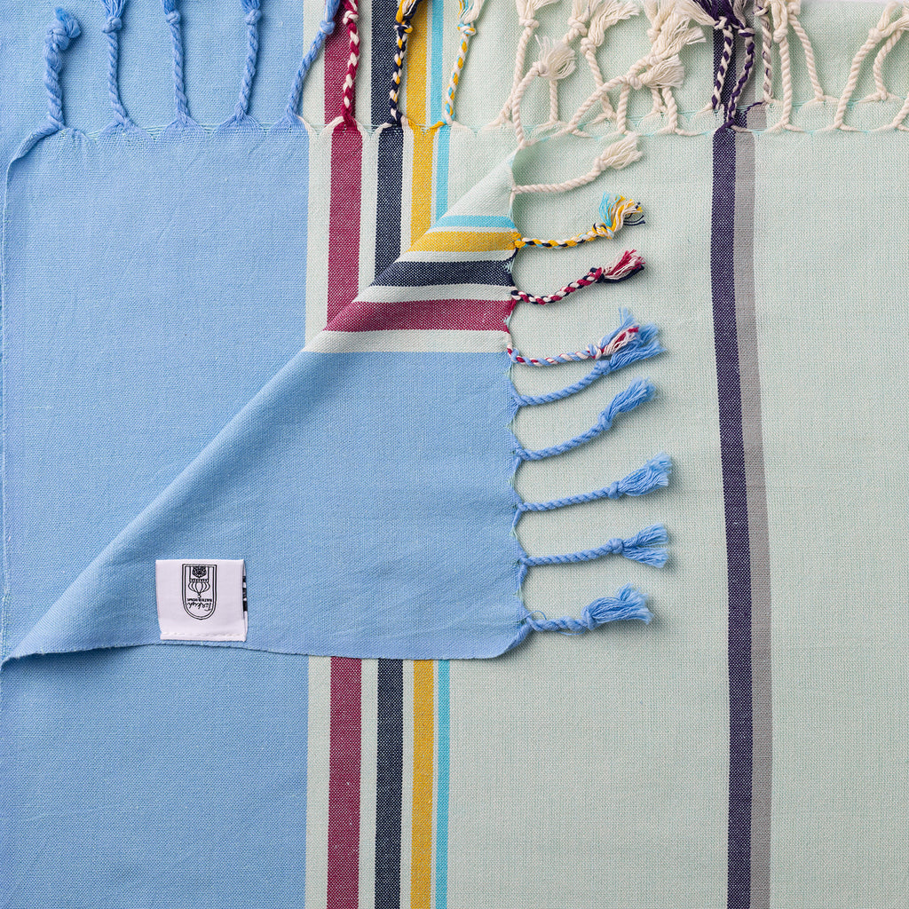 Turkish Bath & Home modern multi stripe lightweight towels in blue and mint, featuring vibrant, colorful striped design.