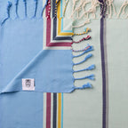 Turkish Bath & Home modern multi stripe lightweight towels in blue and mint, featuring vibrant, colorful striped design.