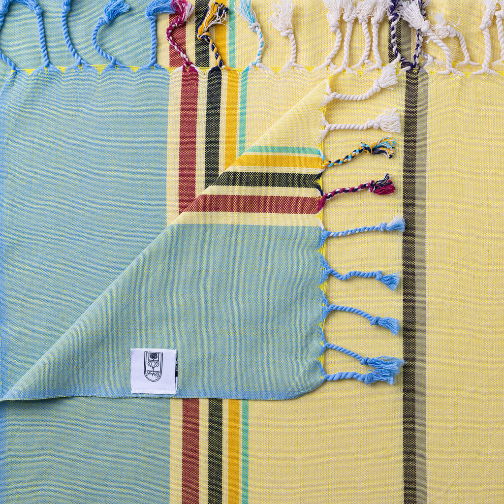 Turkish Bath & Home modern multi stripe lightweight towels in sunflower green with vibrant colorful stripes.