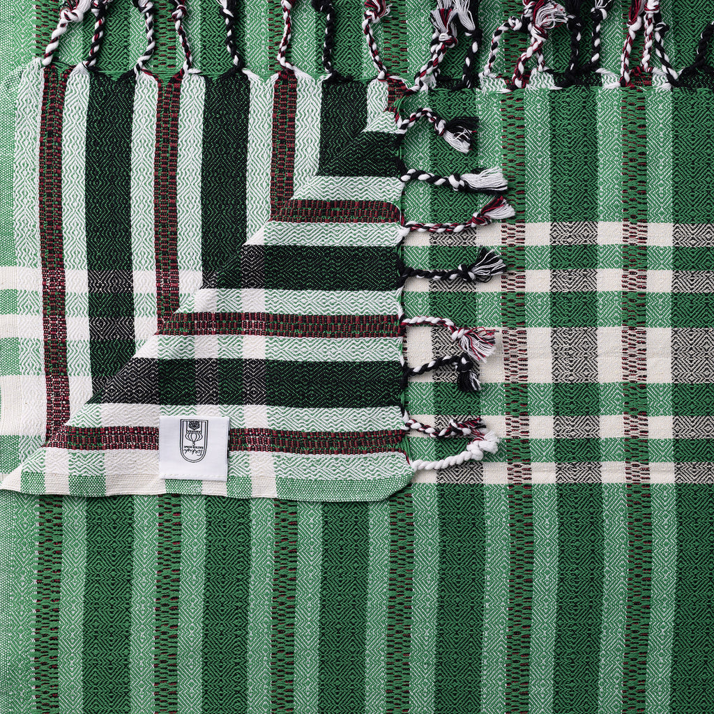 Light green Turkish Bath & Home stripe check lightweight towel with soft, absorbent fabric, ideal for bathroom and beach use.