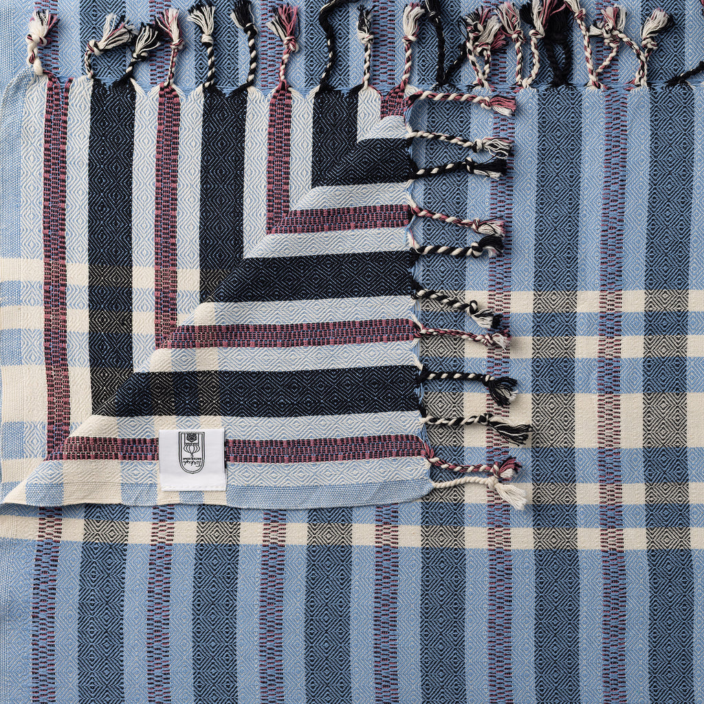 Blue Turkish Bath & Home striped check lightweight towel with modern design, ideal for beach or bath use.