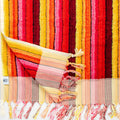 Large thick Turkish cotton beach and bath towel with soft, absorbent fabric and vibrant striped pattern.