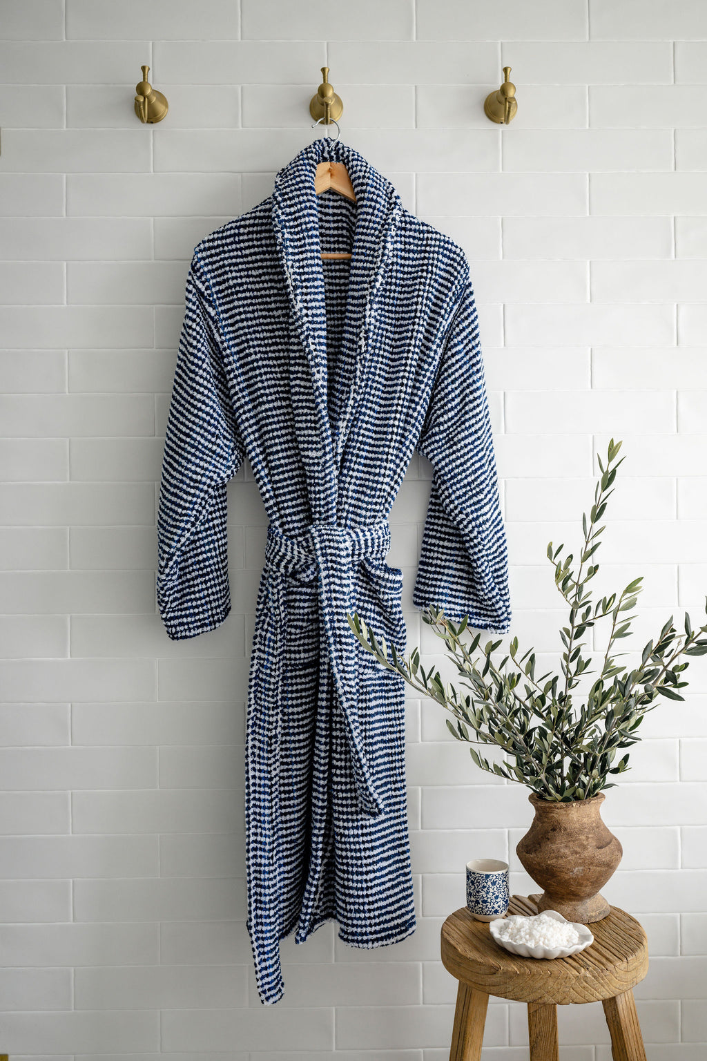 Thick blue and white looped terry towel robe from Turkish Bath & Home, with a cozy, plush texture and knee-length design.