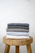 Stack of folded Dot design hand towels